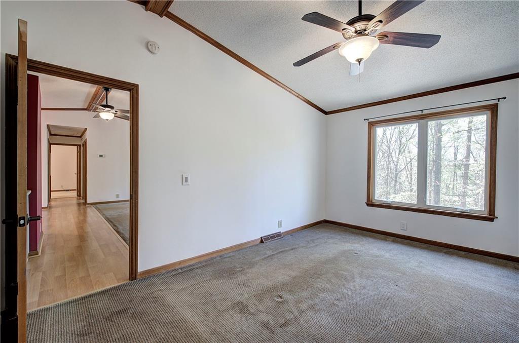147 Laurel Mill Trail Jasper, GA 30143 - Photo 21 of 64 an empty room with chandelier fan and windows