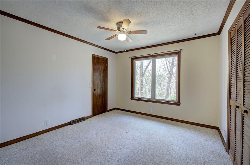 147 Laurel Mill Trail Jasper, GA 30143 - Photo 24 of 64 a view of a livingroom with a ceiling fan and window