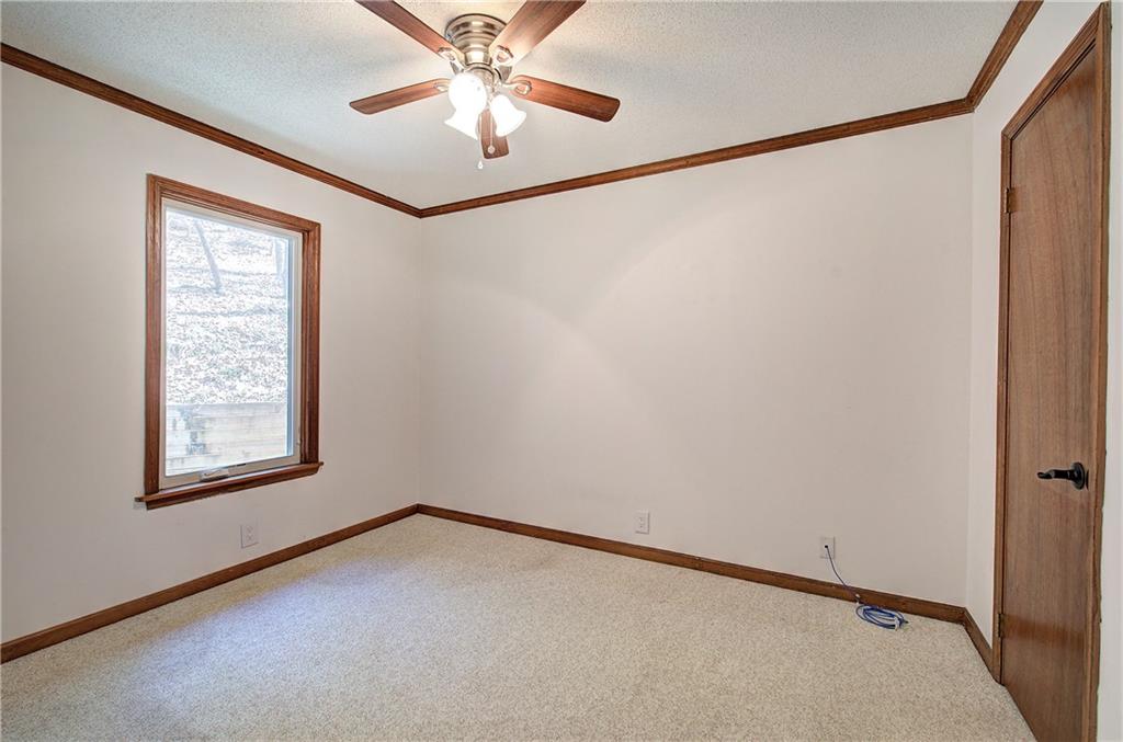 147 Laurel Mill Trail Jasper, GA 30143 - Photo 27 of 64 an empty room with windows and fan