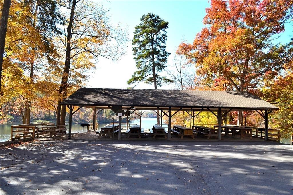 147 Laurel Mill Trail Jasper, GA 30143 - Photo 53 of 64 a view of outdoor space with a table and chairs under an umbrella