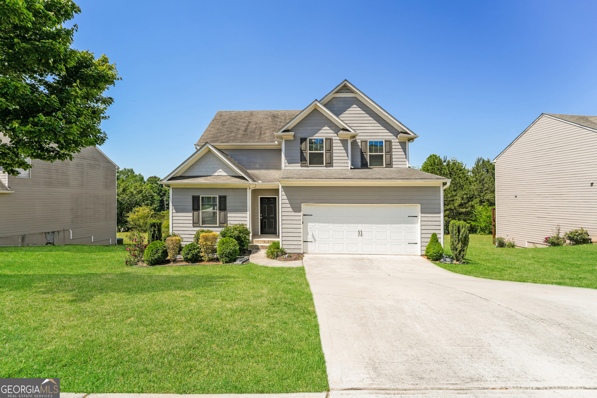 830 Castilla Way Winder, GA 30680 - Photo 1 of 23 a front view of a house with garden