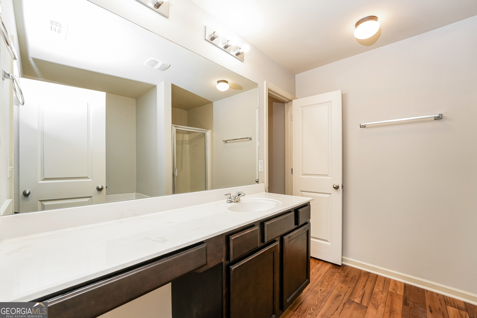 830 Castilla Way Winder, GA 30680 - Photo 12 of 23 a bathroom with a sink a mirror and a shower