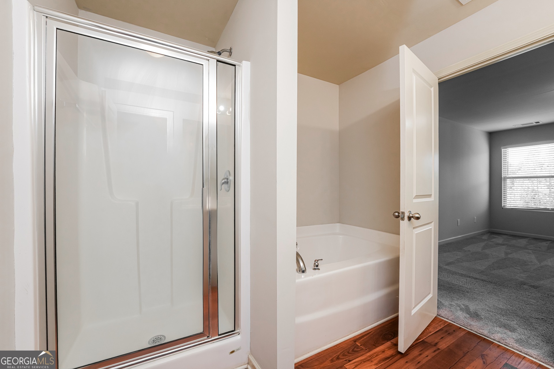 830 Castilla Way Winder, GA 30680 - Photo 14 of 23 a bathroom with a bathtub and a shower