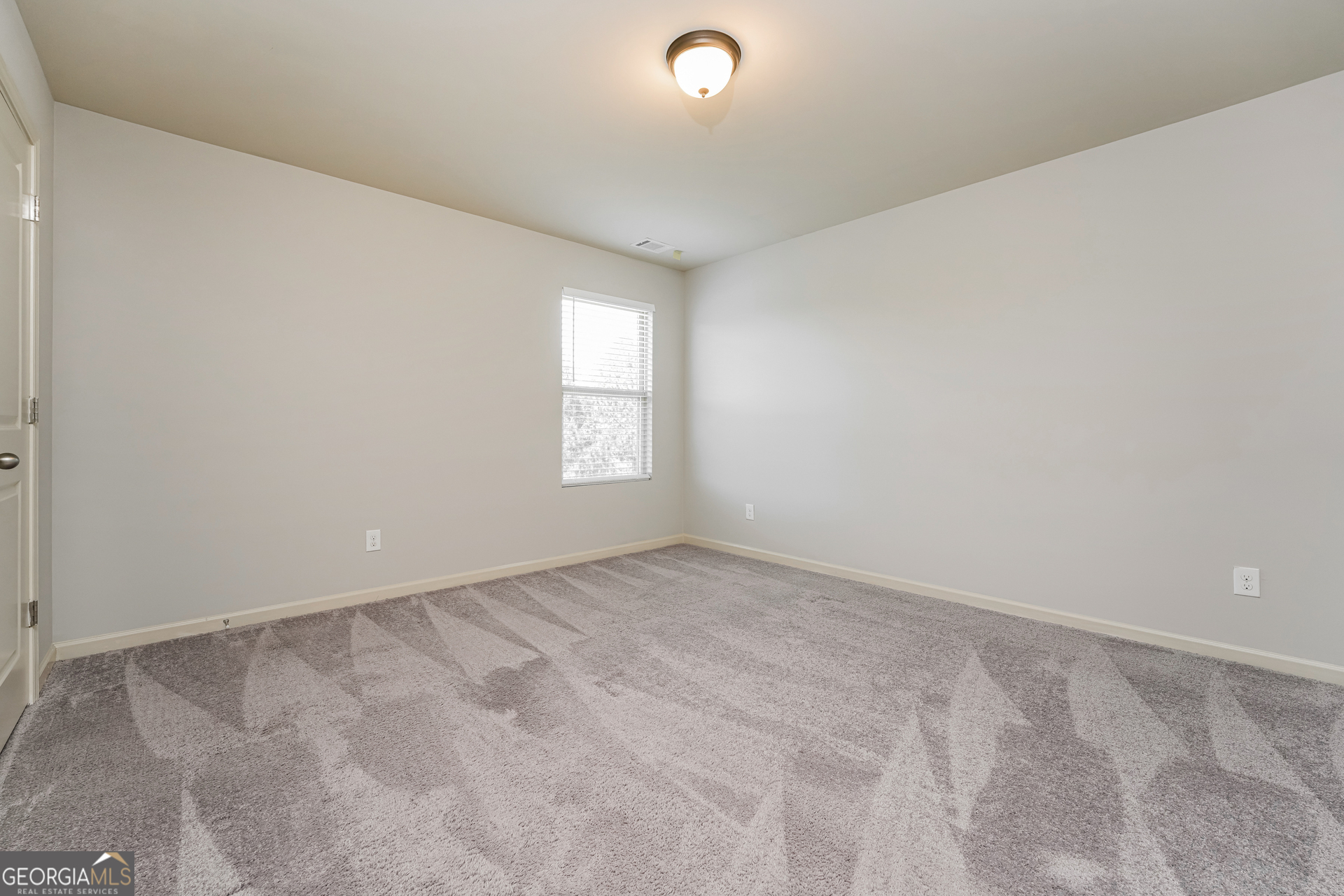 830 Castilla Way Winder, GA 30680 - Photo 15 of 23 an empty room with windows