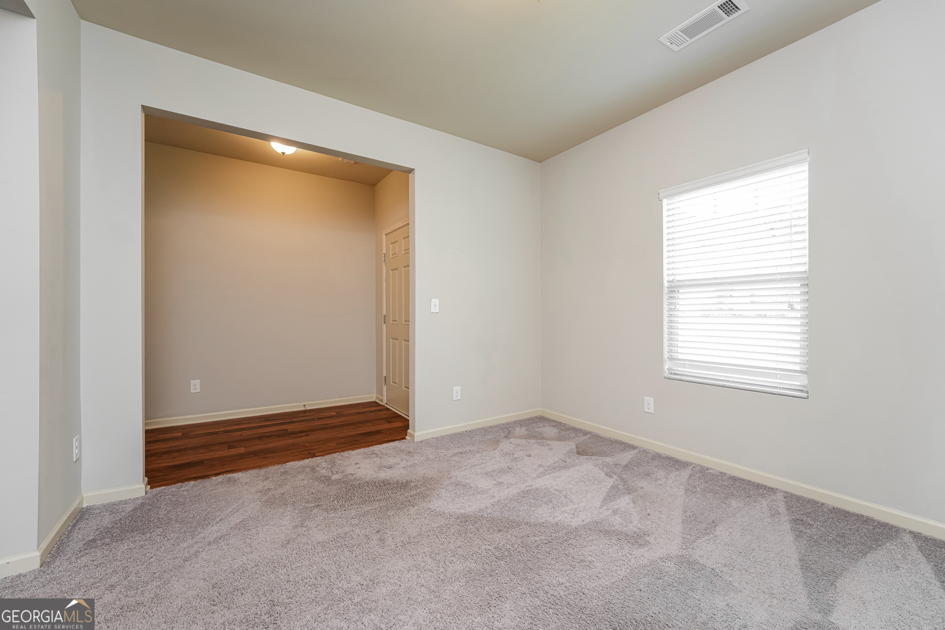 830 Castilla Way Winder, GA 30680 - Photo 8 of 23 a view of an empty room with closet and a window