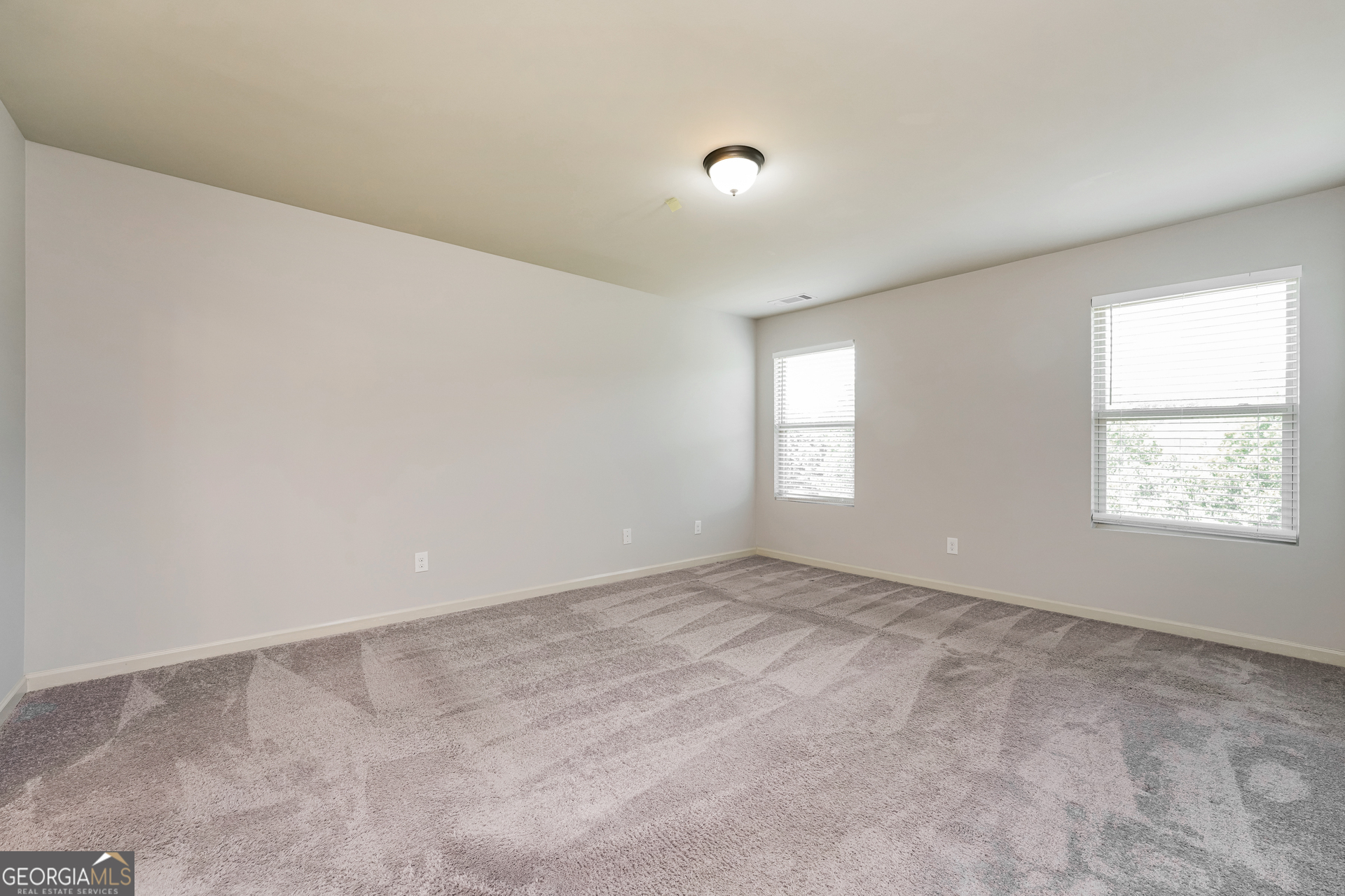 830 Castilla Way Winder, GA 30680 - Photo 10 of 23 an empty room with a window