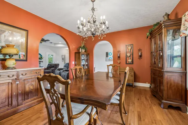 a view of a dining room with furniture and wooden floor