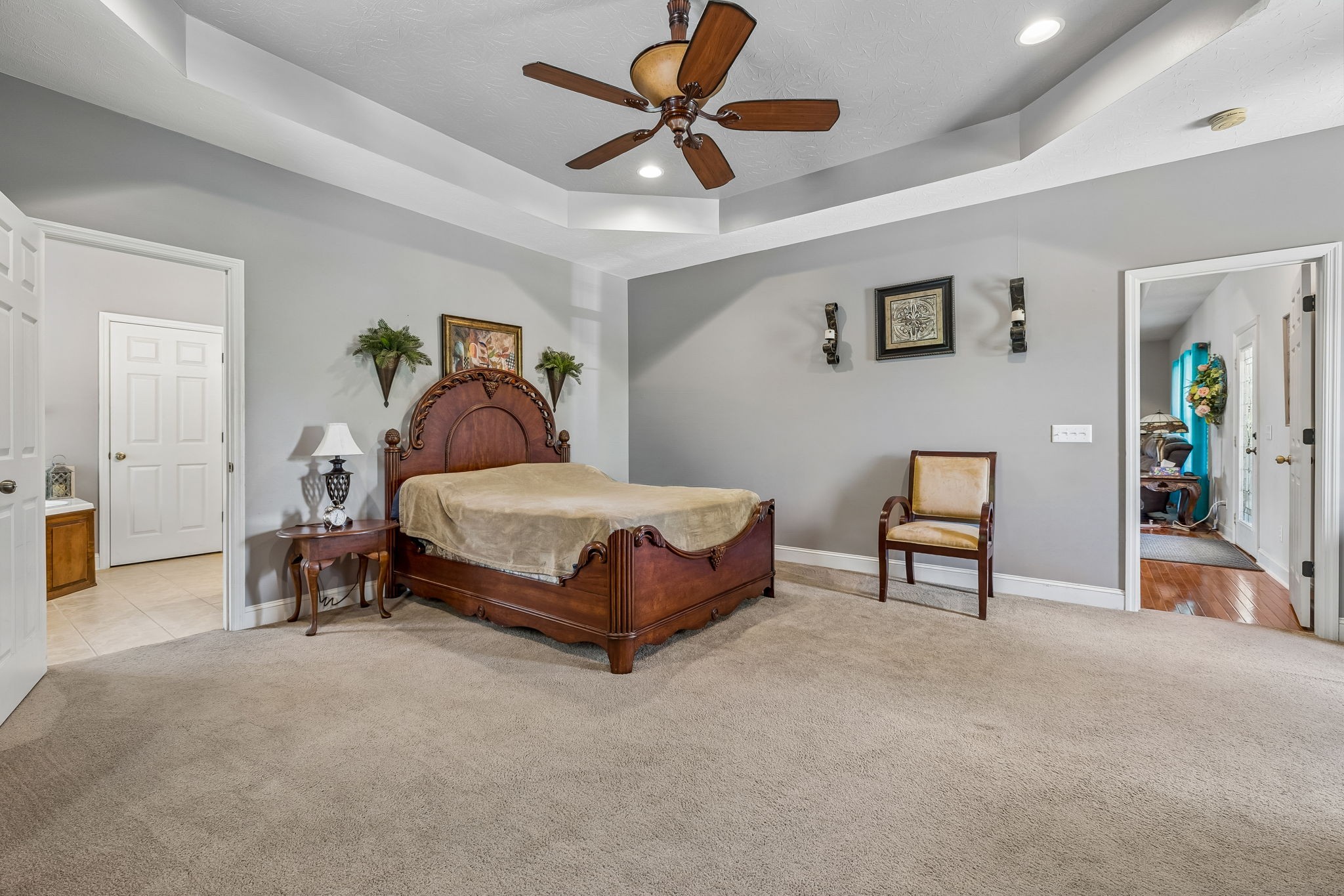 1709 Holland Road Lafayette, TN 37083 - Photo 18 of 44 a bedroom with a bed and a chandelier