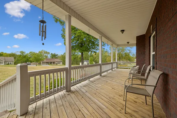 a balcony with wooden floor
