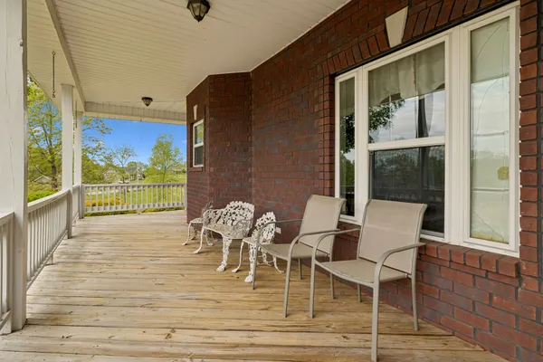 a view of a patio with table and chairs