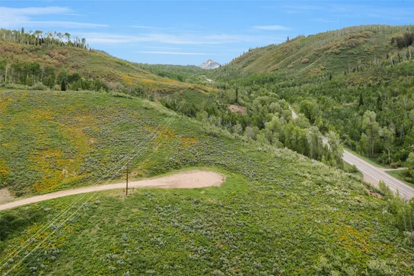 a view of an ocean and a mountain