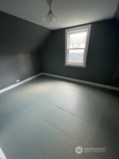 6221 South 129th Street Seattle, WA 98178 - Photo 11 of 20 en empty room with windows and fireplace