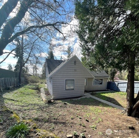 6221 South 129th Street Seattle, WA 98178 - Photo 13 of 20 a view of a house with a yard