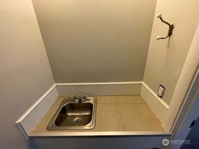 6221 South 129th Street Seattle, WA 98178 - Photo 8 of 20 a bathroom with a sink and tub