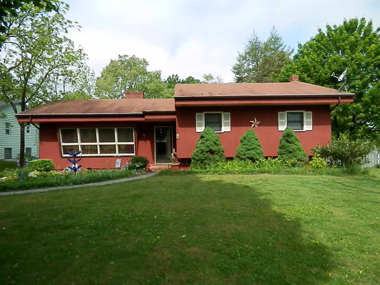 1595 Mt Torrey Road Lyndhurst, VA 22952 - Photo 1 of 29 a front view of a house with a garden and plants