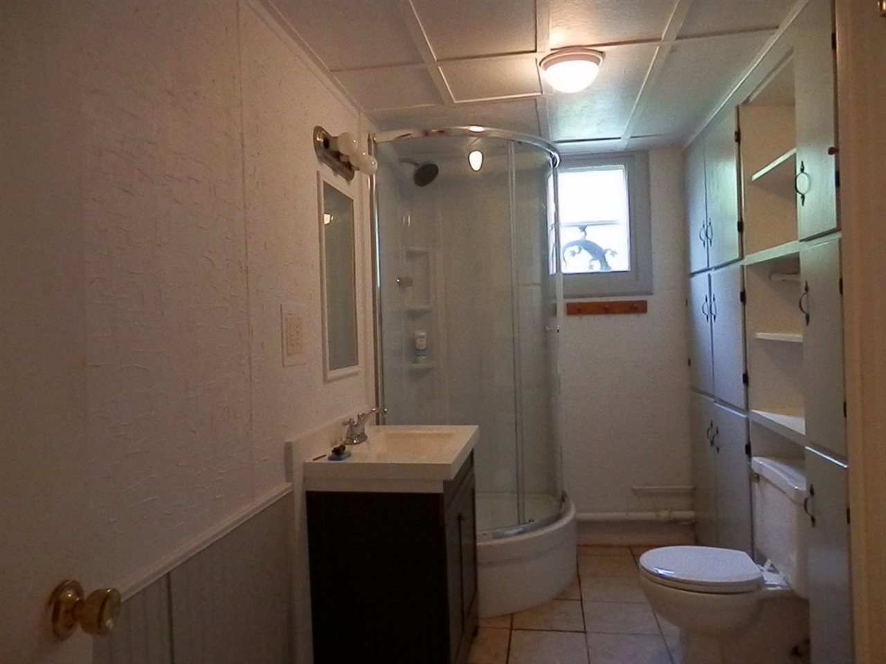 1595 Mt Torrey Road Lyndhurst, VA 22952 - Photo 25 of 29 a bathroom with a toilet sink and mirror