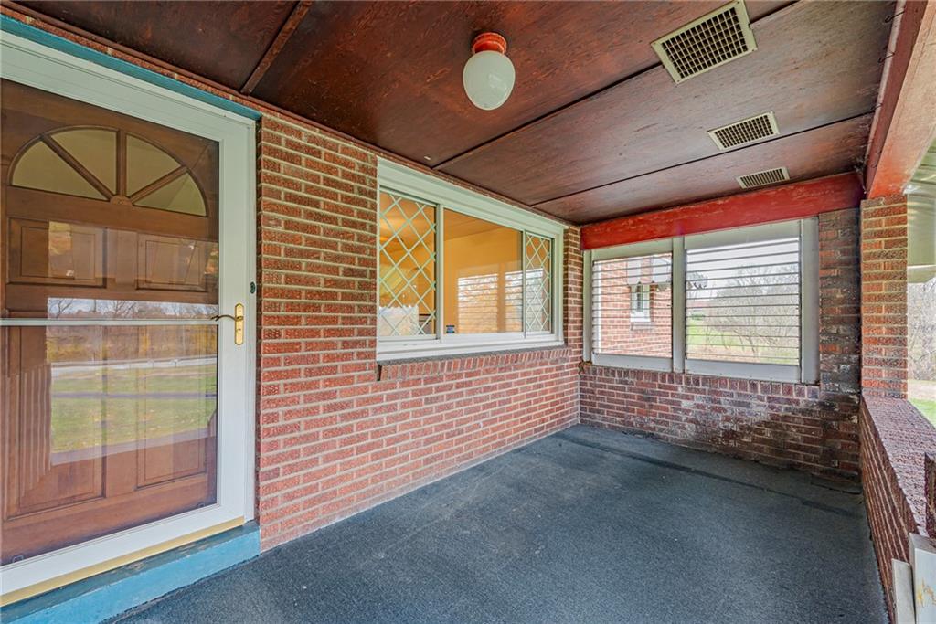 735 Highway 56 Apollo, PA 15613 - Photo 2 of 20 a view of an empty room with a window