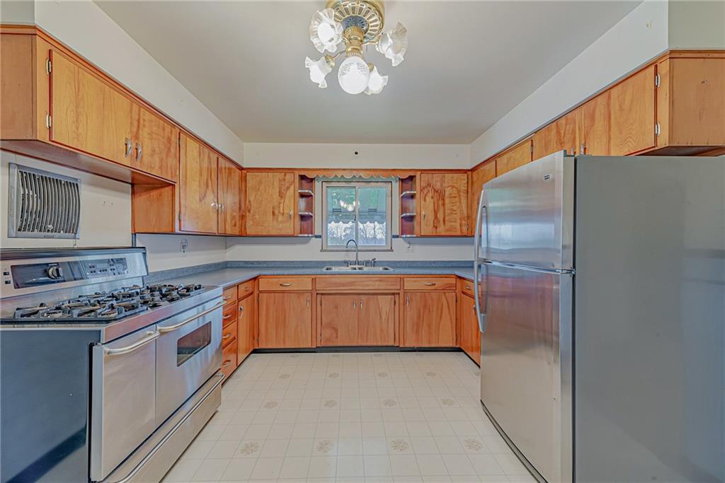 735 Highway 56 Apollo, PA 15613 - Photo 7 of 20 a kitchen with stainless steel appliances granite countertop a stove a sink dishwasher and a refrigerator