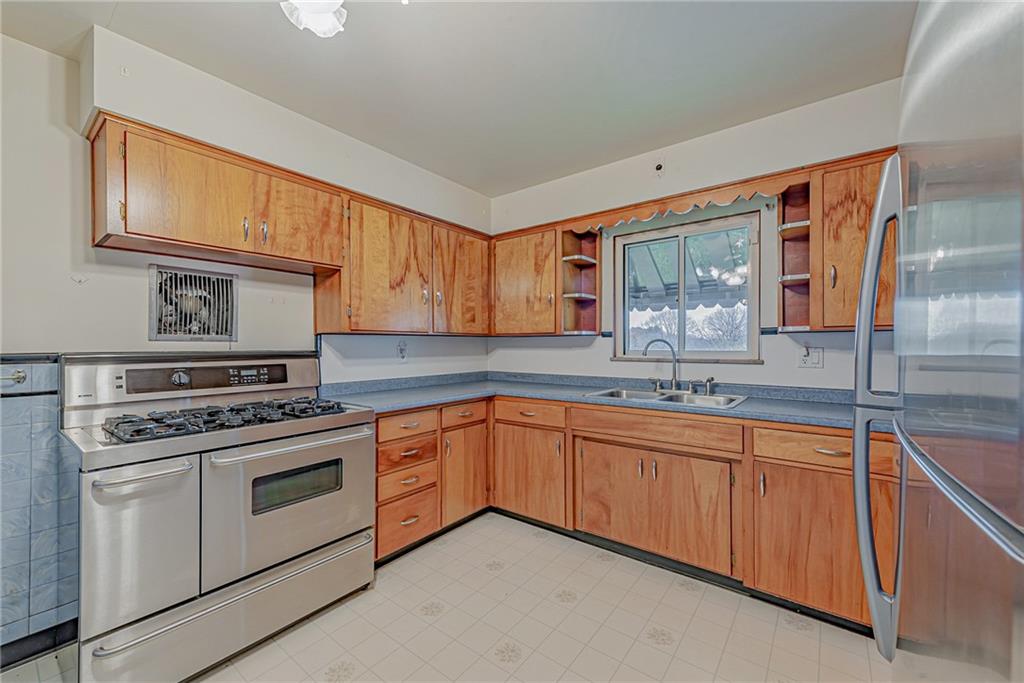 735 Highway 56 Apollo, PA 15613 - Photo 8 of 20 a kitchen with stainless steel appliances granite countertop a stove sink and cabinets