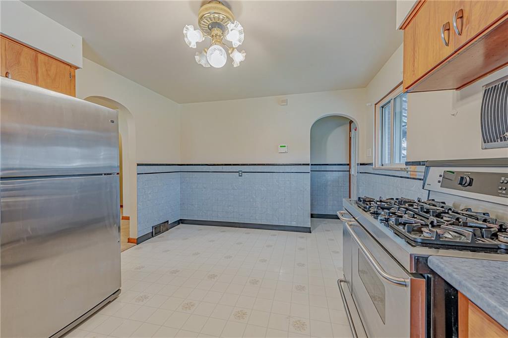 735 Highway 56 Apollo, PA 15613 - Photo 9 of 20 a kitchen with stainless steel appliances granite countertop a stove and a refrigerator