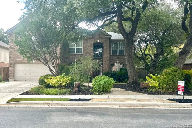 front view of a house with a garden