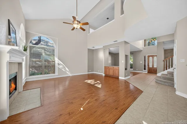 a view of an empty room with a fireplace