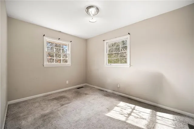 an empty room with windows