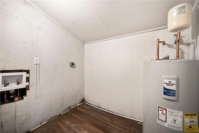 a view of a room with wooden floor and bathroom
