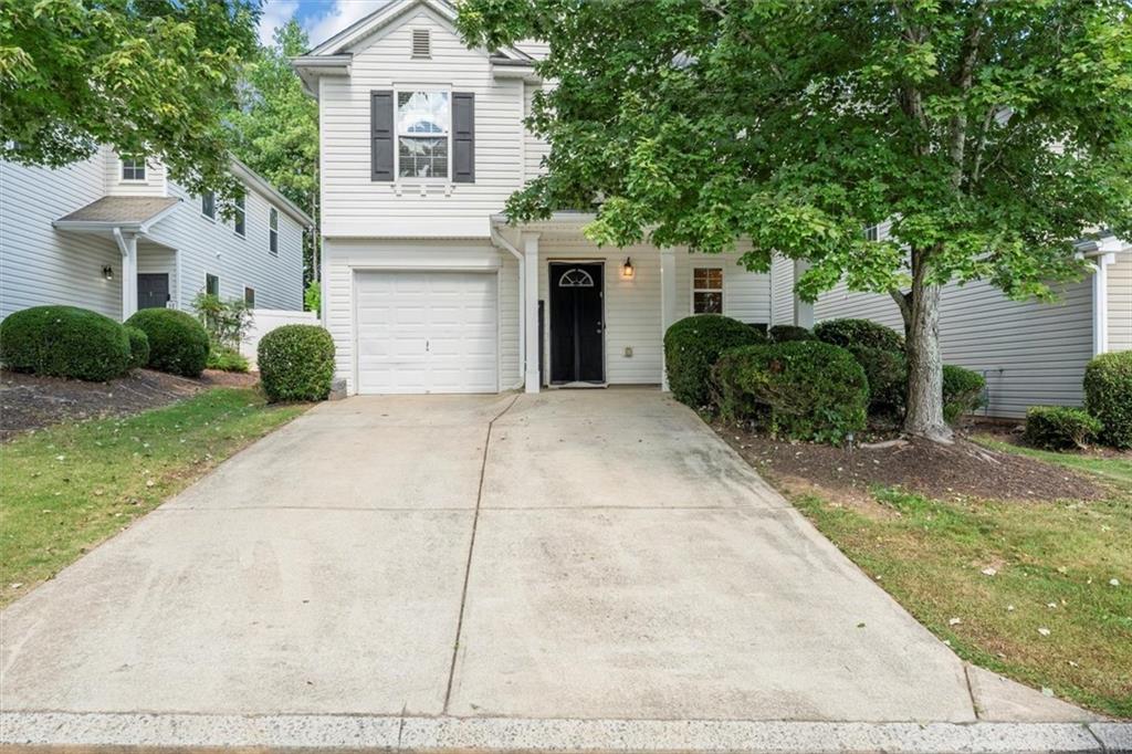 245 Silver Spring Street Dallas, GA 30157 - Photo 1 of 1 a front view of a house with garden