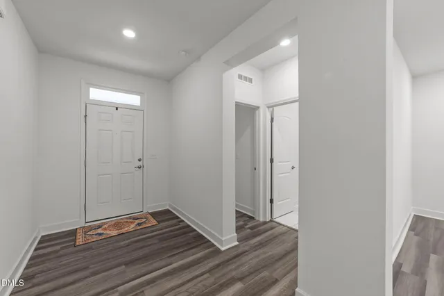 a view of room with wooden floor