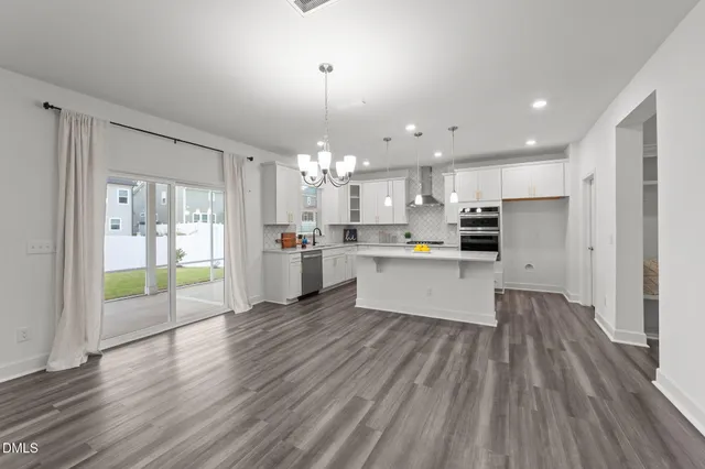 a view of kitchen with wooden floor