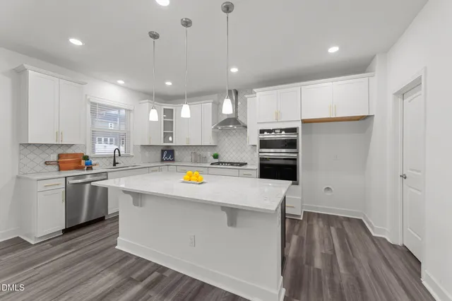 a view of kitchen with wooden floor