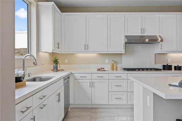 a kitchen with a sink and a window
