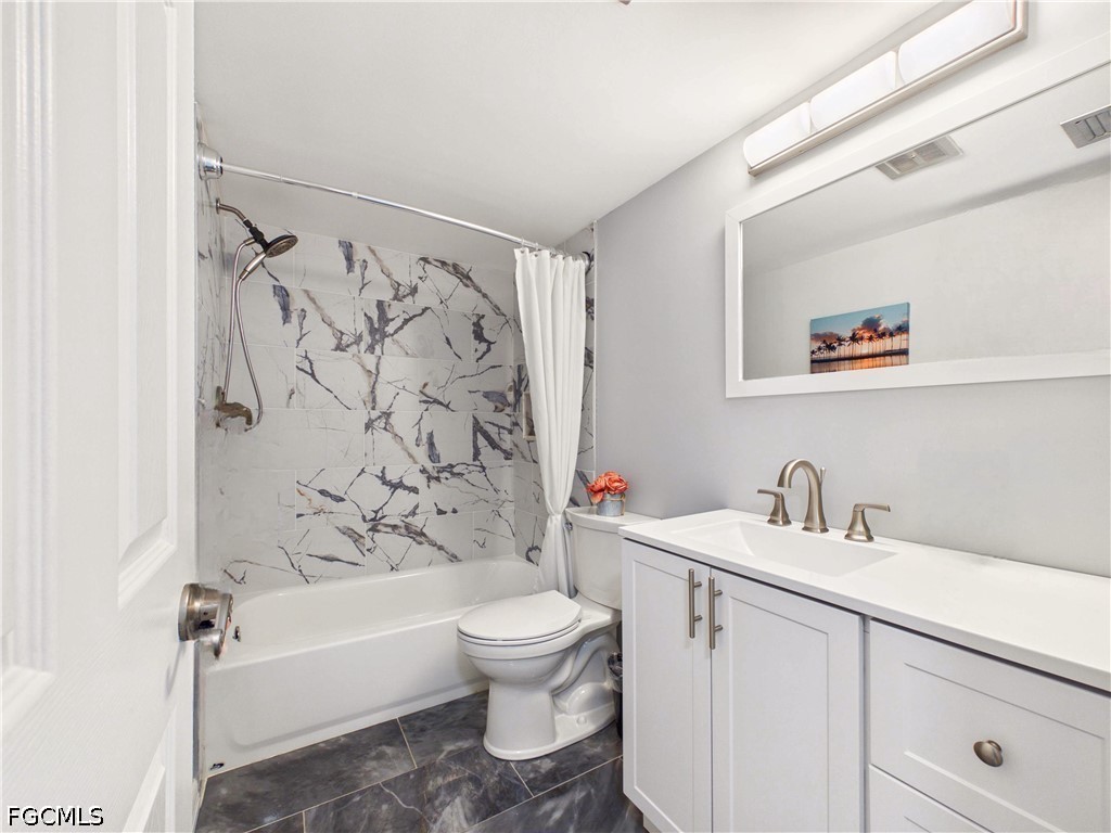 300 Valley Stream Drive, Unit 3D Naples, FL 34113 - Photo 15 of 21 a bathroom with a sink a toilet and a bathtub