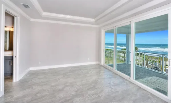 a view of an empty room and window
