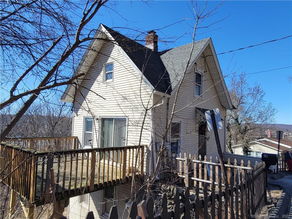 a view of a house with a small yard