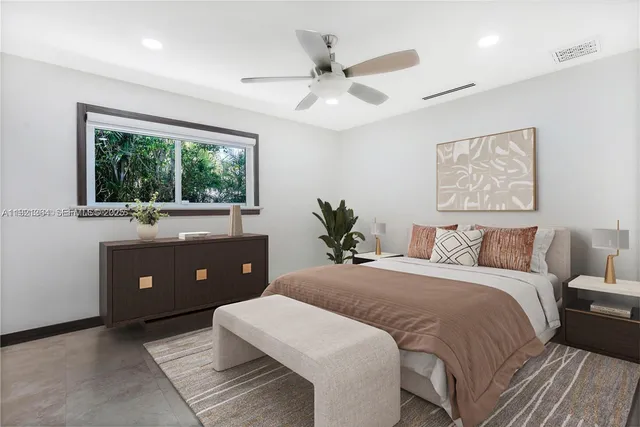 a kitchen with stainless steel appliances kitchen island granite countertop a refrigerator and a stove