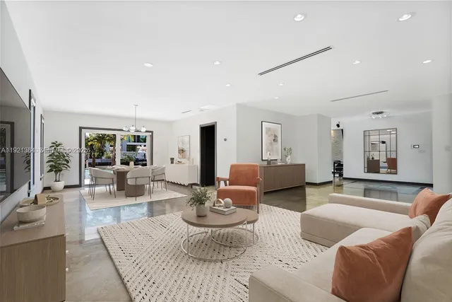 a living room with fireplace furniture and a flat screen tv