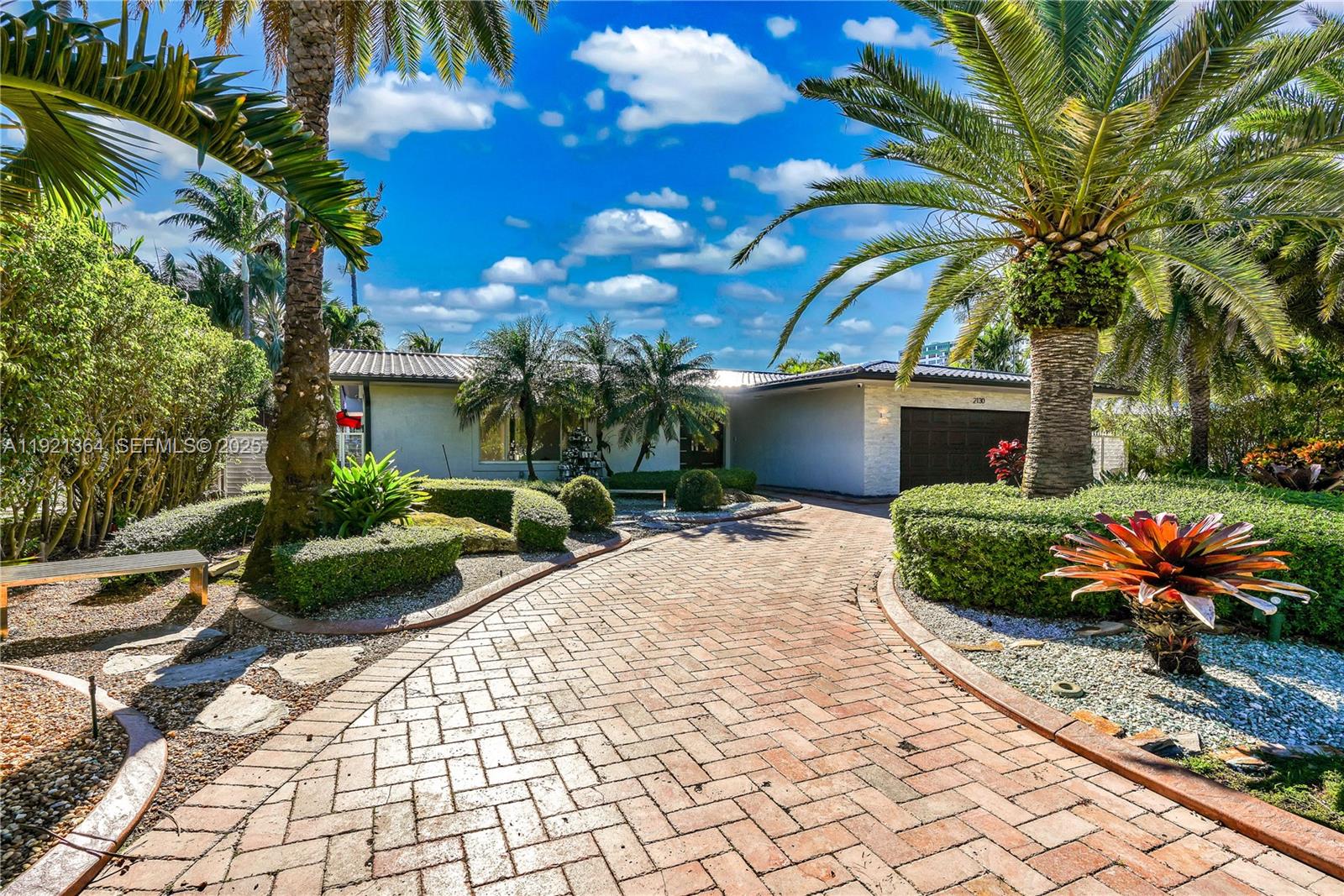 2130 Northeast 122nd Road North Miami, FL 33181 - Photo 39 of 86 a front view of a house with a yard