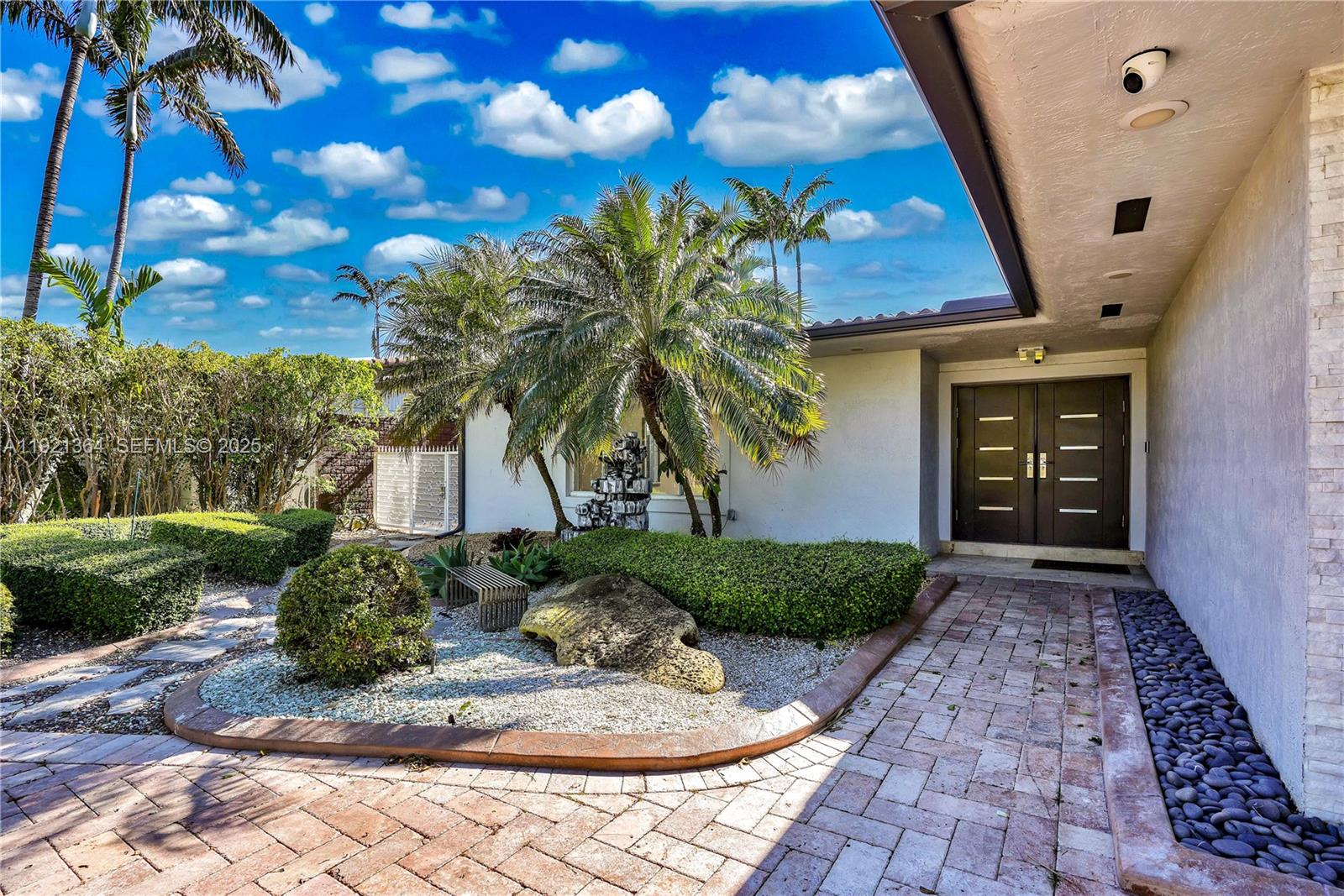 2130 Northeast 122nd Road North Miami, FL 33181 - Photo 40 of 86 a front view of a house with garden
