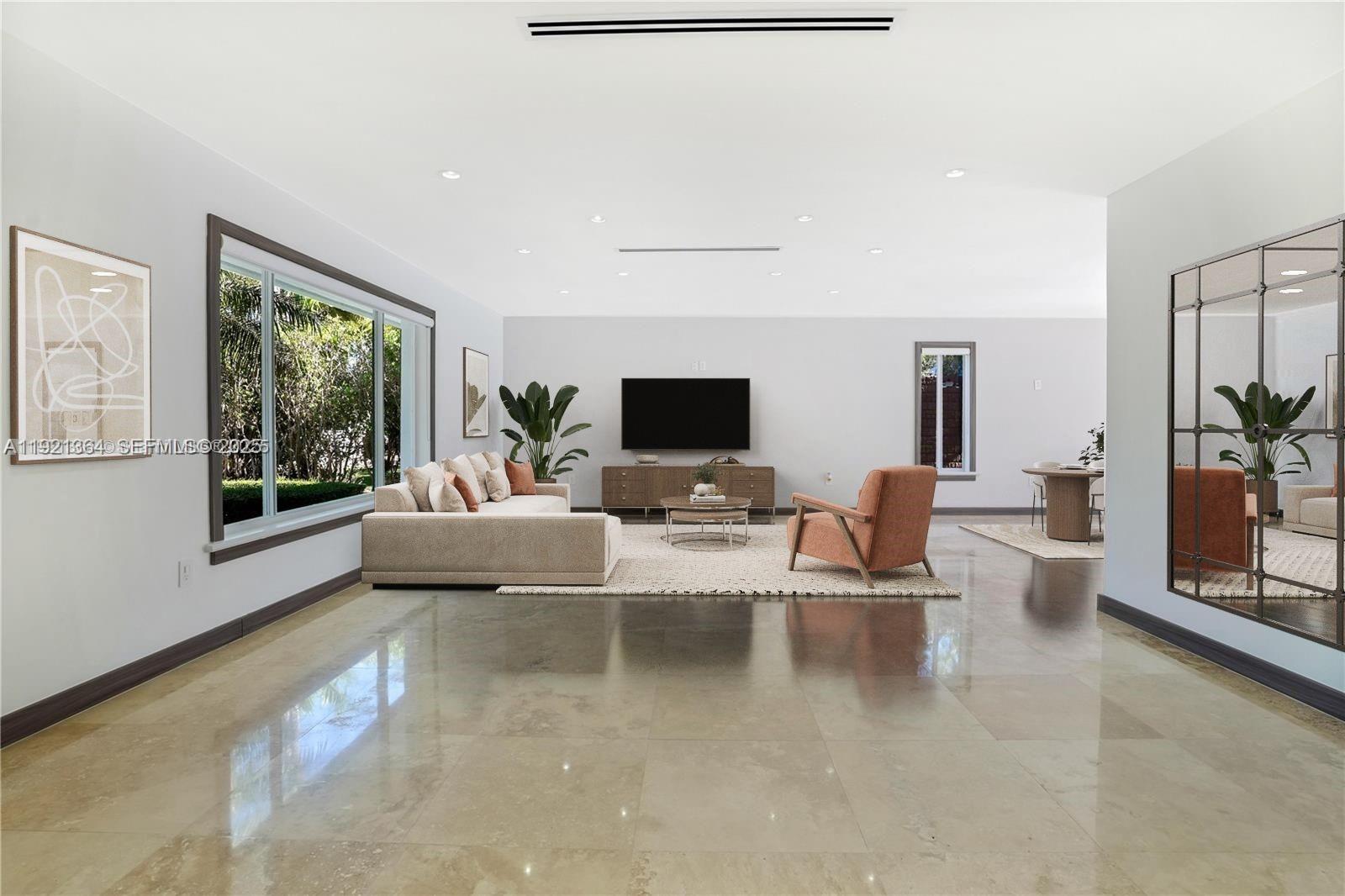 2130 Northeast 122nd Road North Miami, FL 33181 - Photo 4 of 86 a living room with fireplace furniture and a flat screen tv