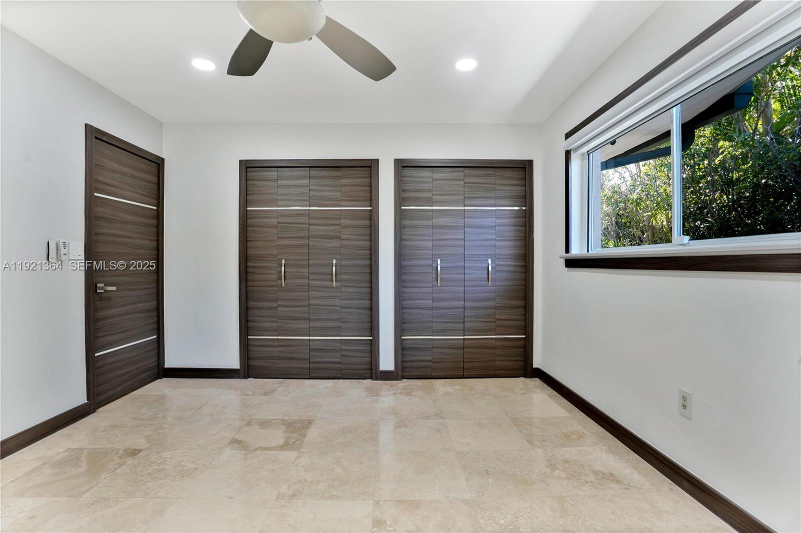 2130 Northeast 122nd Road North Miami, FL 33181 - Photo 57 of 86 a view of empty room with a ceiling fan