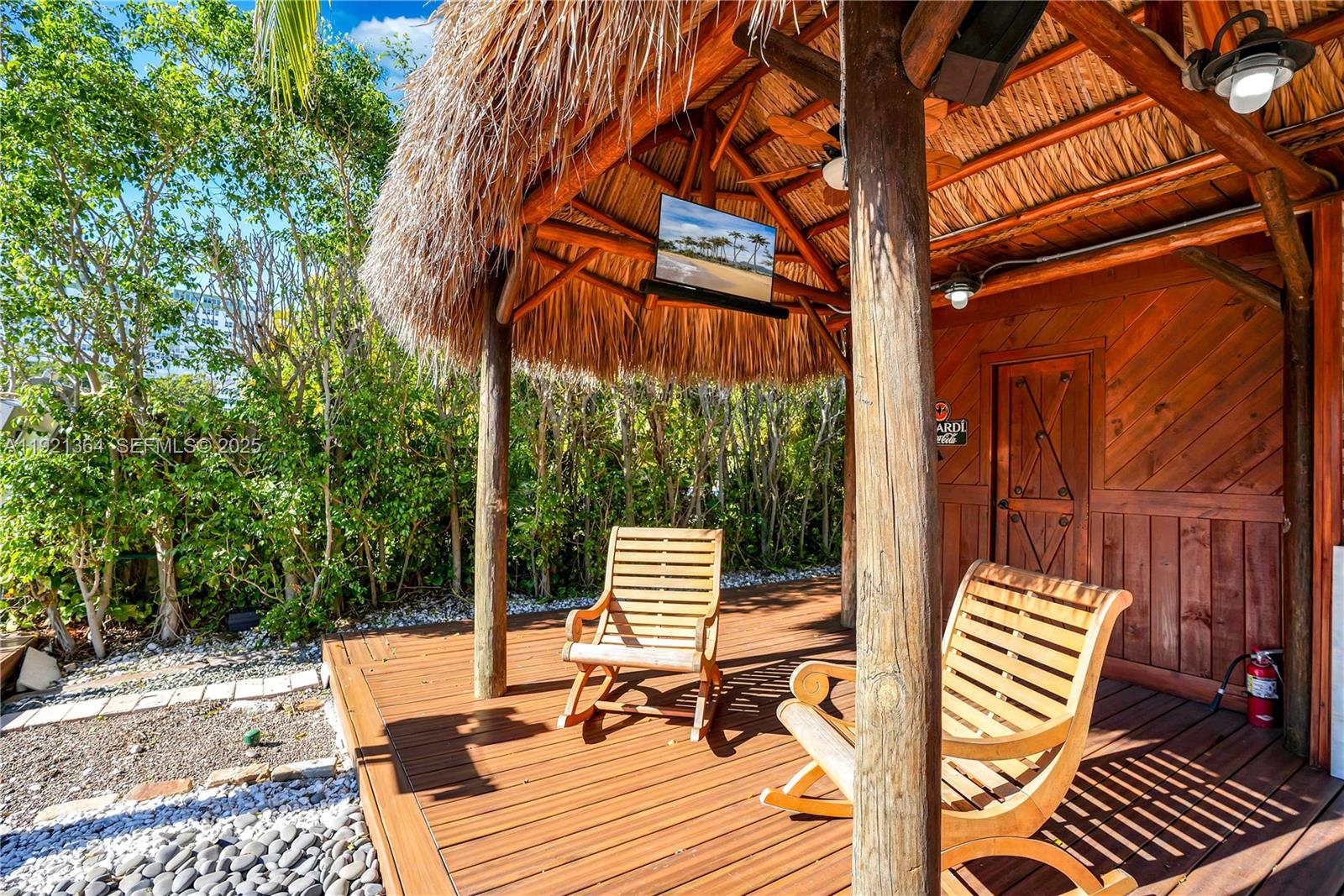 2130 Northeast 122nd Road North Miami, FL 33181 - Photo 70 of 86 a view of sitting area with chairs and wooden fence