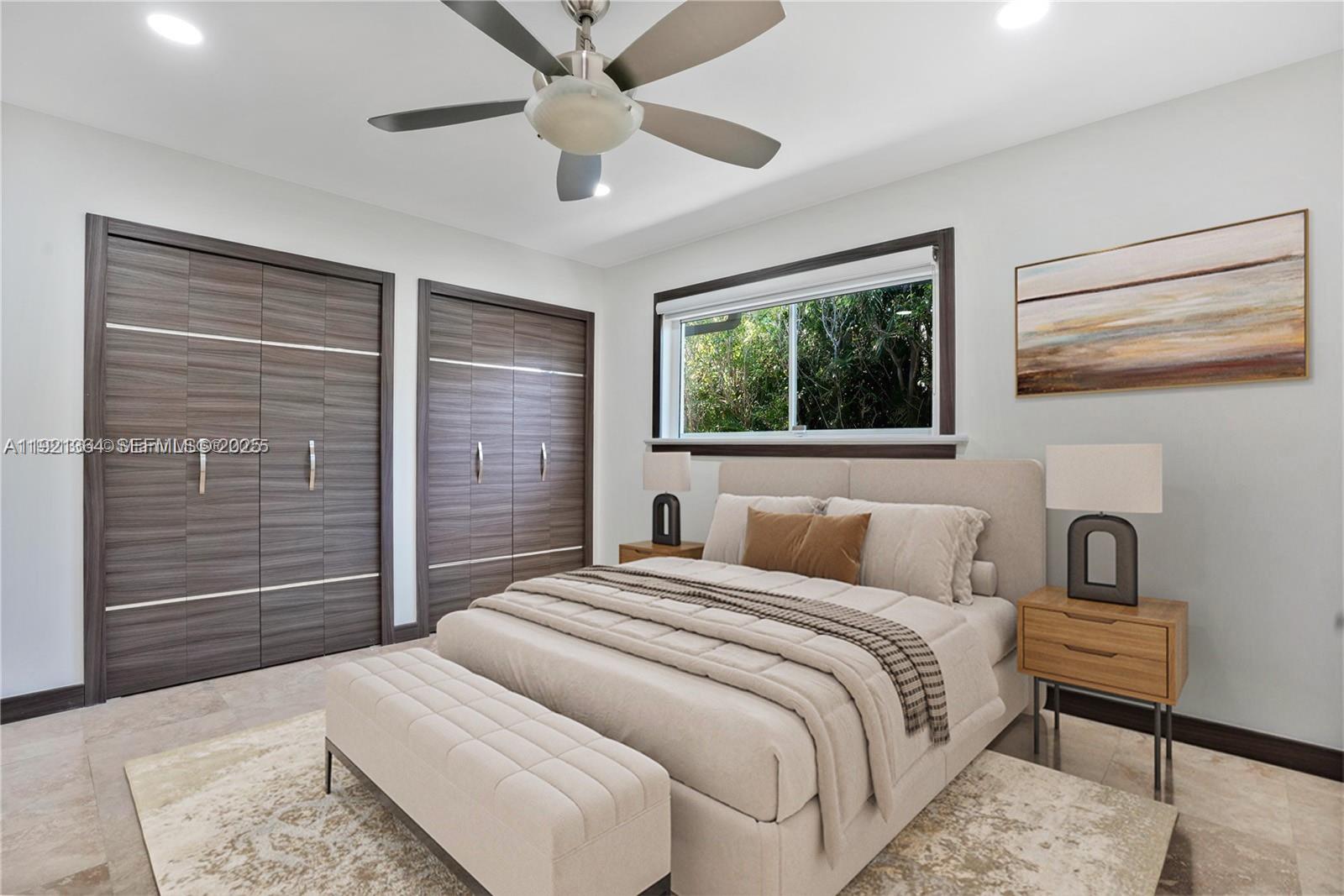 2130 Northeast 122nd Road North Miami, FL 33181 - Photo 9 of 86 a bedroom with a bed and a chandelier