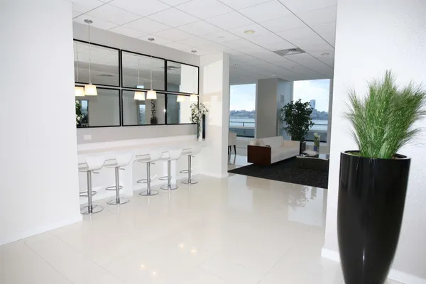 a lobby with furniture and potted plant