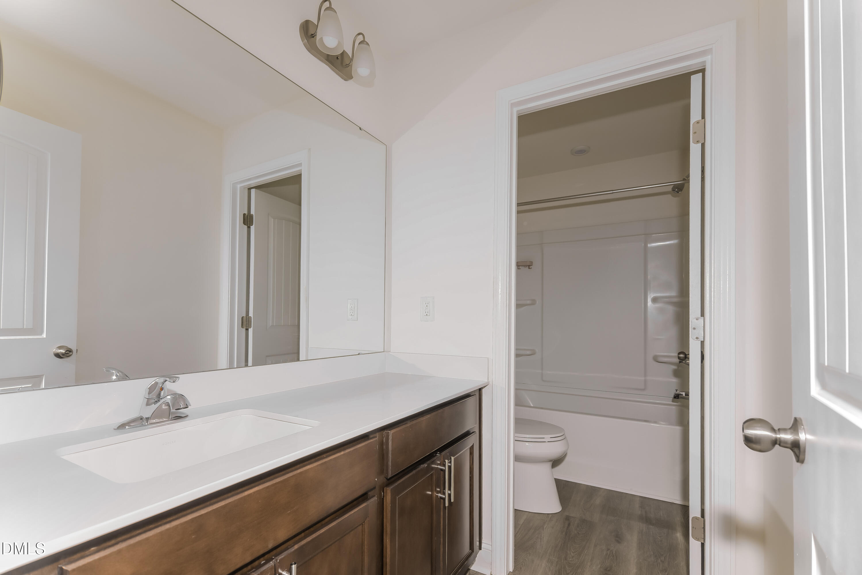 20 Misty Grove Trail Franklinton, NC 27525 - Photo 12 of 17 a bathroom with a granite countertop sink toilet and shower