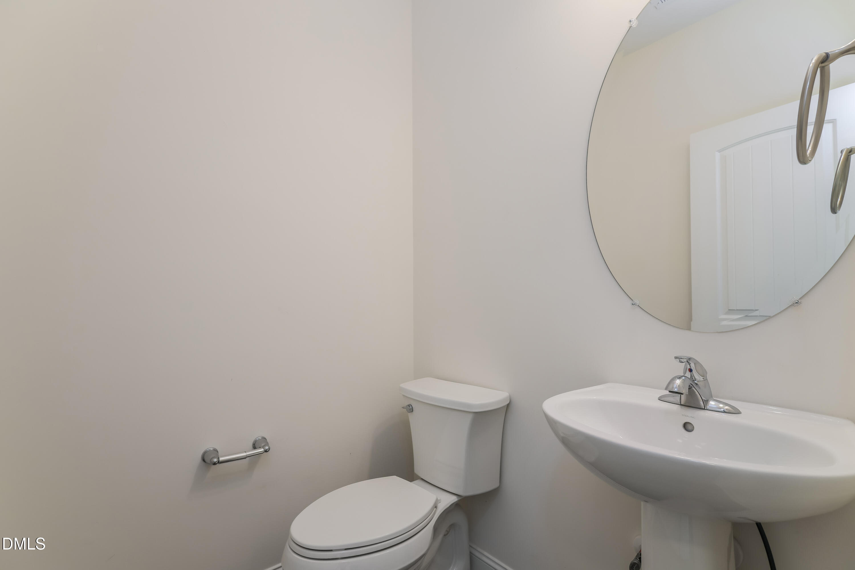 20 Misty Grove Trail Franklinton, NC 27525 - Photo 13 of 17 a bathroom with a sink a toilet and a mirror