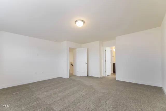 a bathroom with a sink shower and a mirror