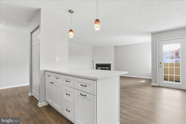 a view of kitchen with wooden floor