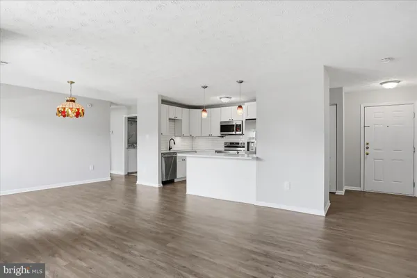 a view of kitchen with wooden floor